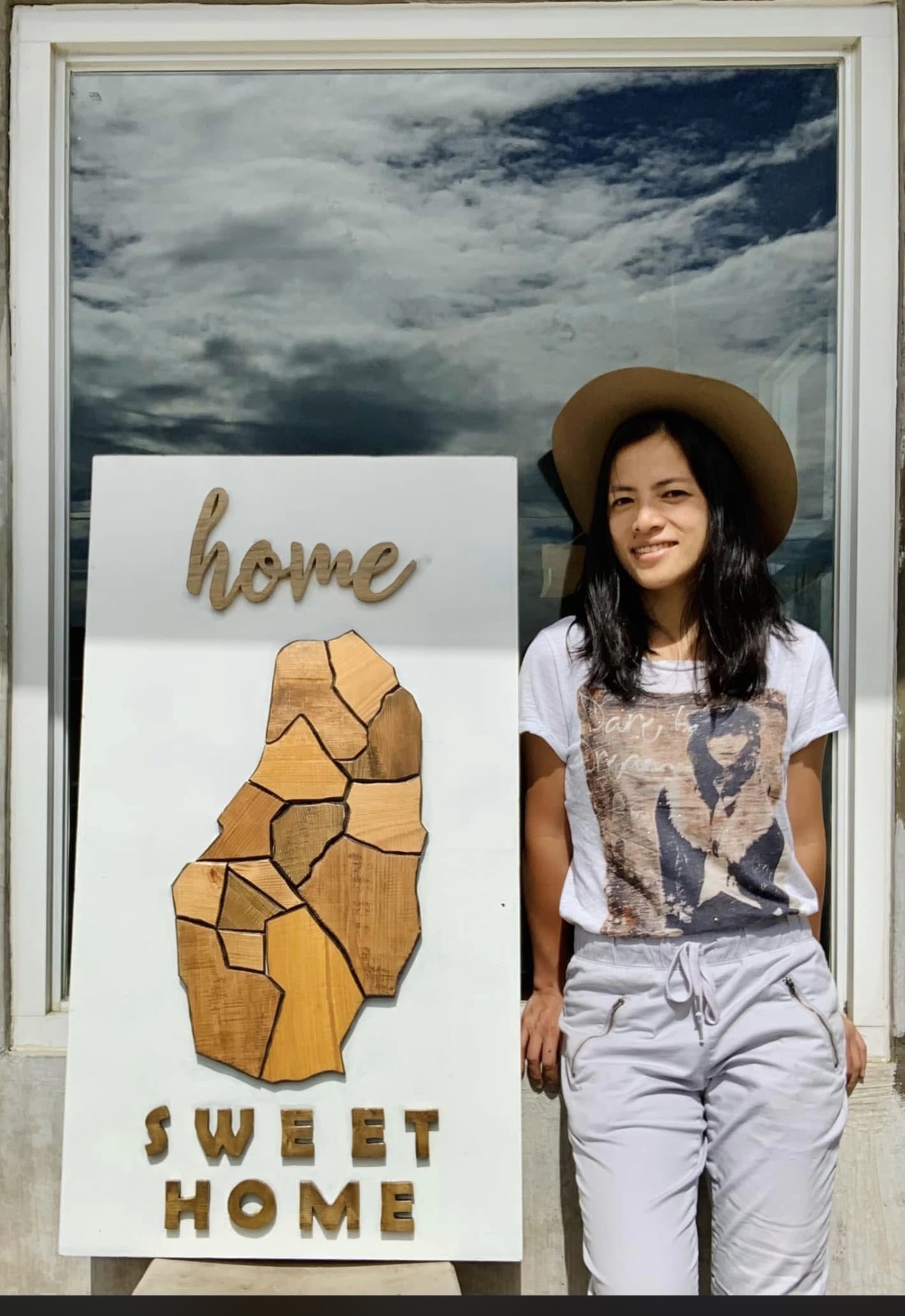 Handmade wooden Benguet map sign with home script and SWEET HOME block letters on a white board